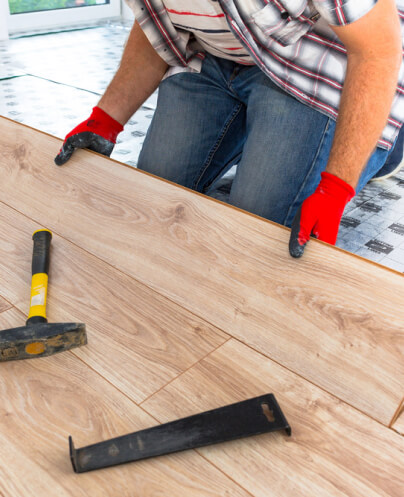 img - handyman-installing-new-laminated-wooden-floor
