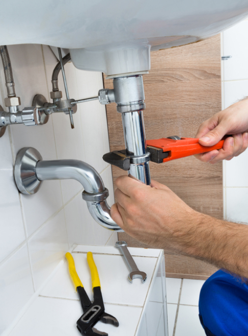 male-plumber-fixing-sink