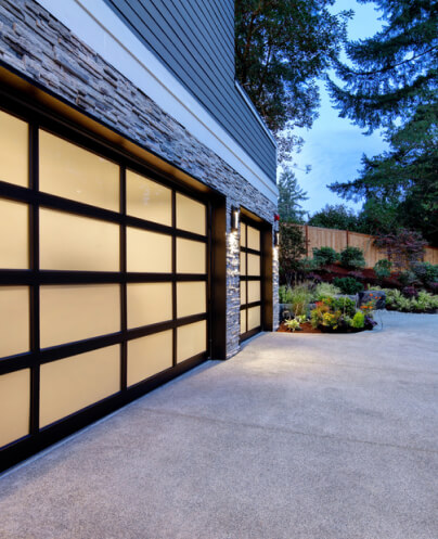modern-house-exterior-two-car-garage-spacious-driveway-twilight